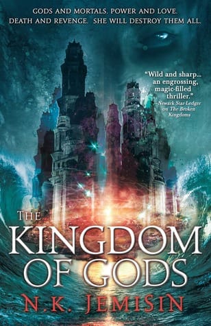 Book cover of The Kingdom of the Gods by N.K. Jemisin. A face from the shadows gazes towards a crumbling city.