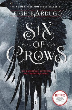 Cover of Six of Crows by Leigh Bardugo featuring a back Crow flying on a grey cloudy day